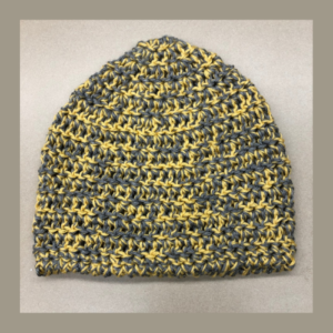 A yellow and gray crocheted hat